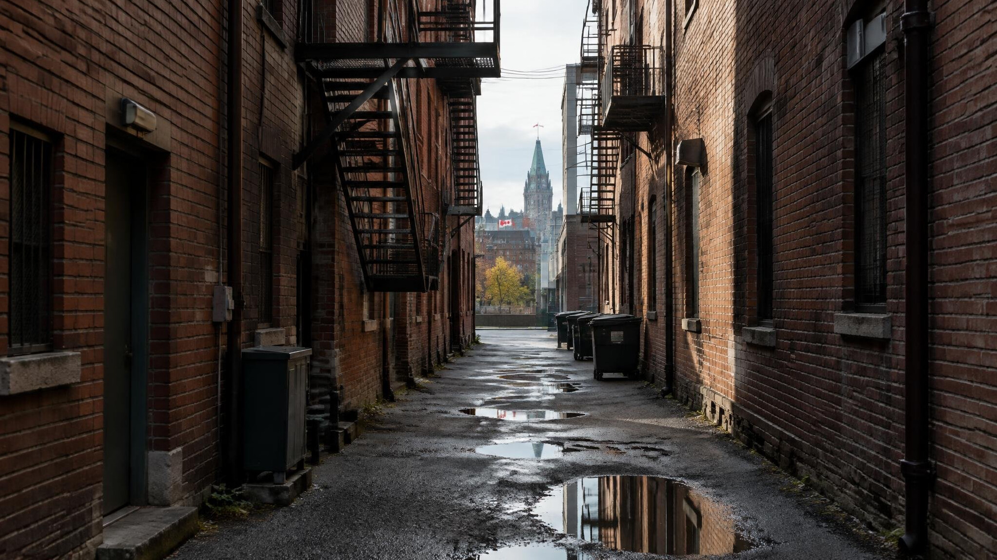 Narrow city alley between brick buildings