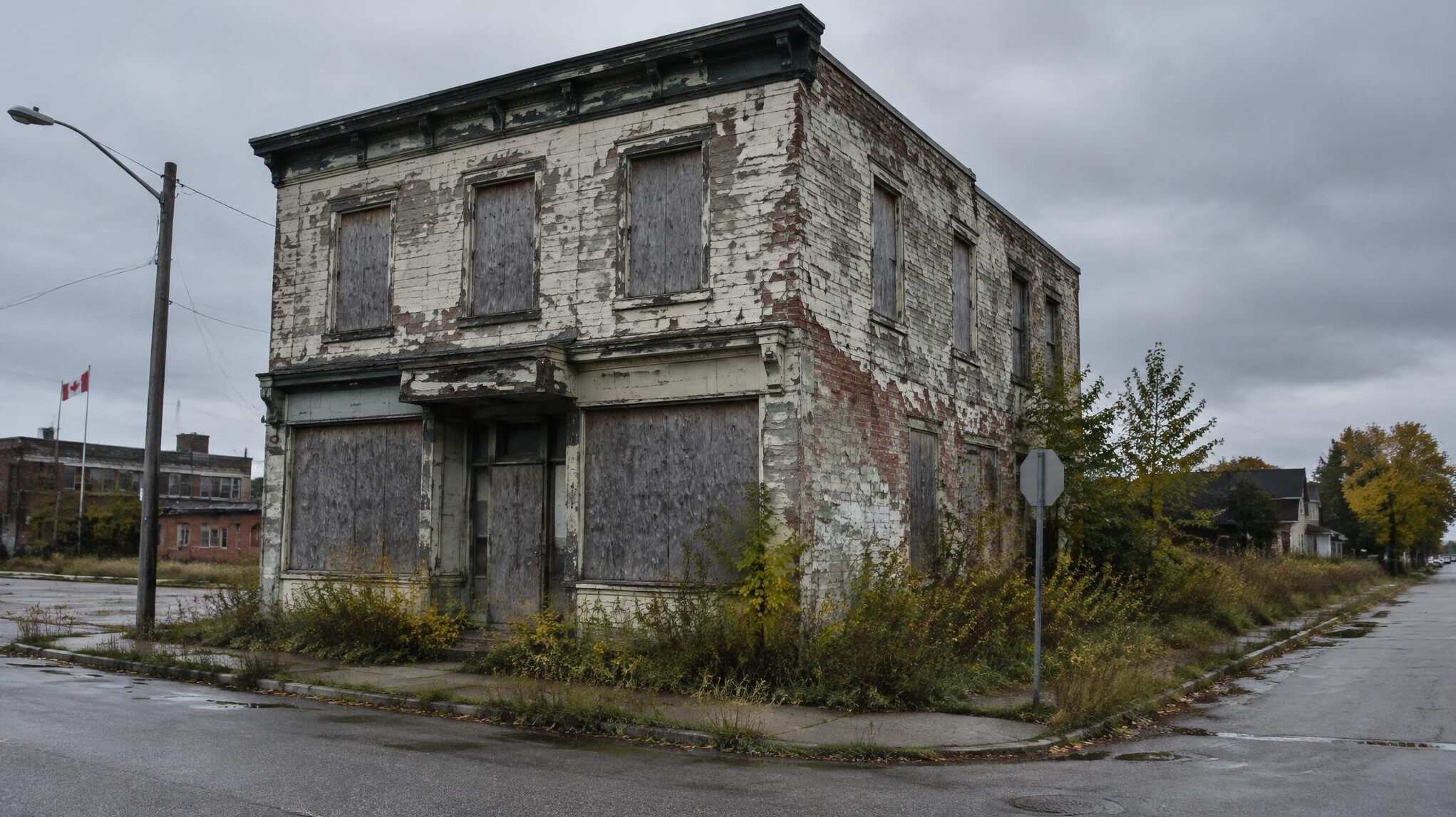 Abandoned building with boarded windows and peeling paint